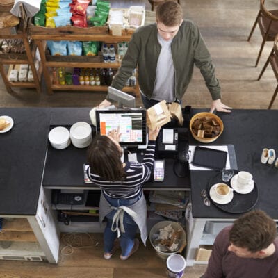 High angle view of customer at the counter of a coffee